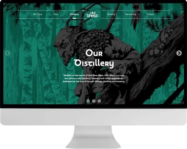 Bespoke websites for our client Uile-bheist displayed on a monitor